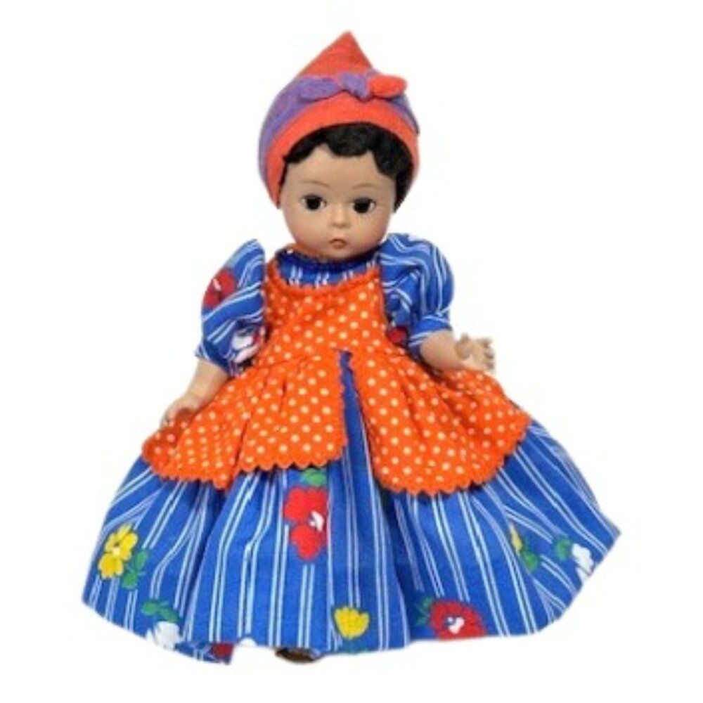 Madame Alexander restrung 8" Jamaica doll with stand.
